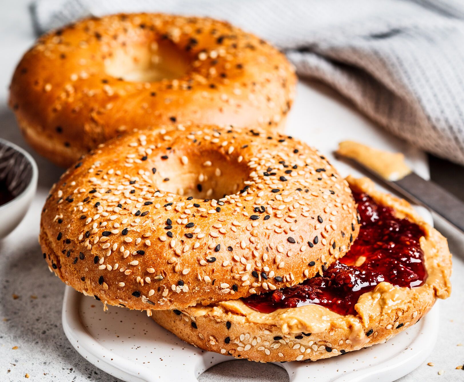 Bagel, peanut butter and raspberries