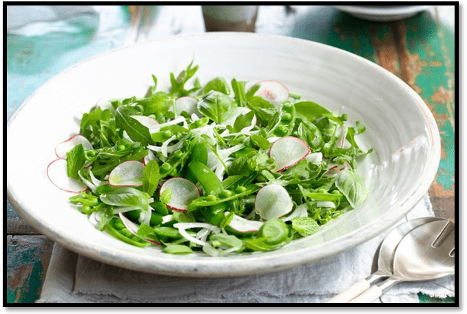 Sugar snap pea salad with shaved onion, radish, basil, and mint
