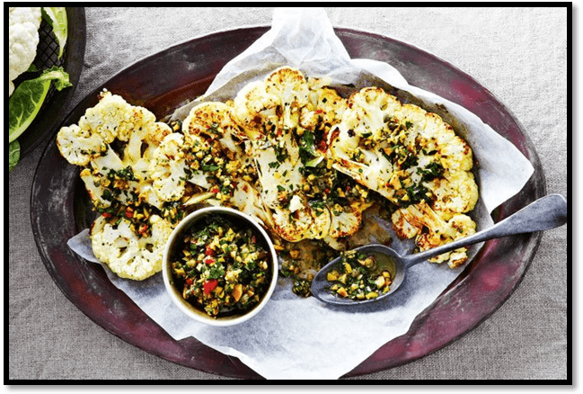 Cauliflower steaks with olive and herb salsa