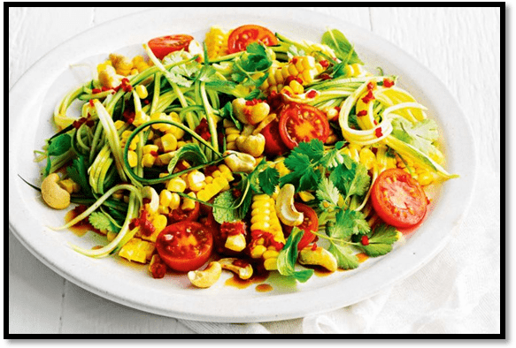 Zucchini noodle salad with herbs, cashews and chilli dressing