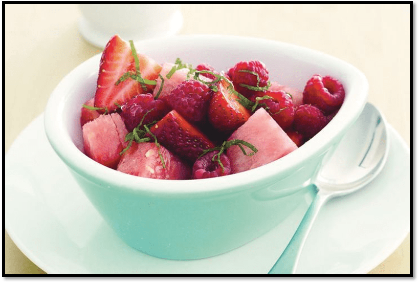 Red fruit salad with mint syrup