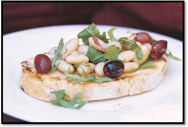 Bruschetta with white beans and olives